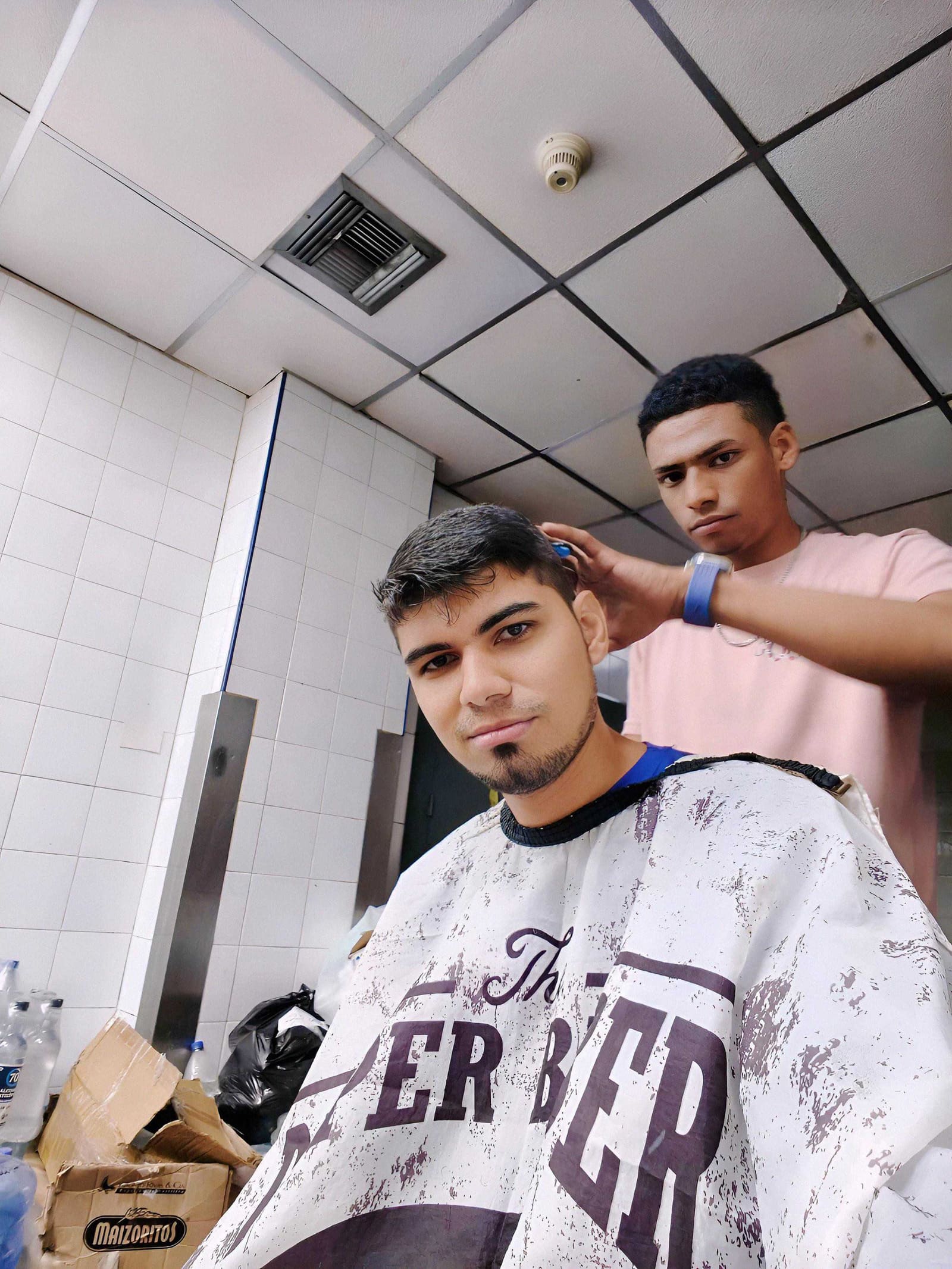 Orlando Briceño getting a haircut during the months he spent at the epicenter